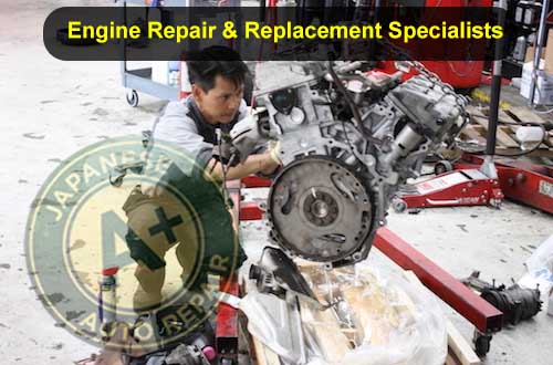 Mechanic fixing engine - Engine Repair & Replacement Specialists - A+ Japanese Auto Repair Inc.
